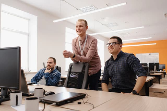 Three person looking something
